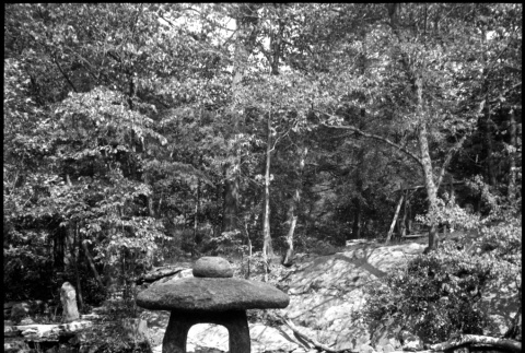 Stone sculpture alongside creek (ddr-densho-377-1585)