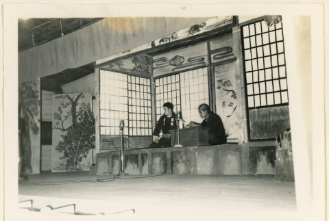 Actors seated on a stage (ddr-densho-37-1234)