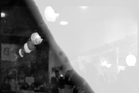 Damaged negative of countertop with lanterns above (ddr-densho-426-1760)