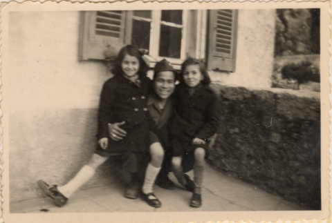 Soldier posing with two young girls (ddr-densho-466-292)