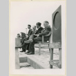 Men stand on a stage (ddr-densho-37-1145)