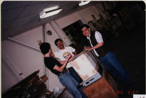 Three men in warehouse (ddr-densho-426-1353)