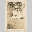 Man sitting on grass (ddr-densho-316-281)
