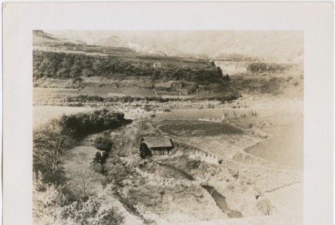 A water wheel in an agricultural valley (ddr-densho-299-26)