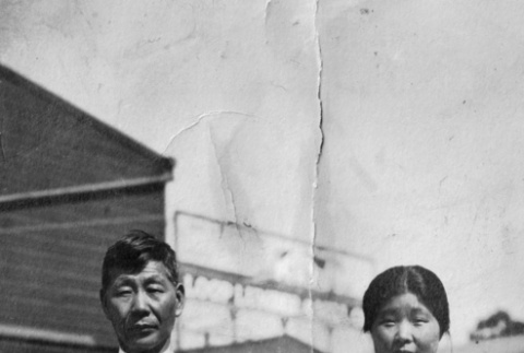 Man and woman with young girl outside Nursery building (ddr-ajah-6-407)