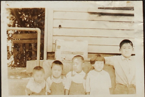 Five children lined up outside (ddr-densho-259-45)