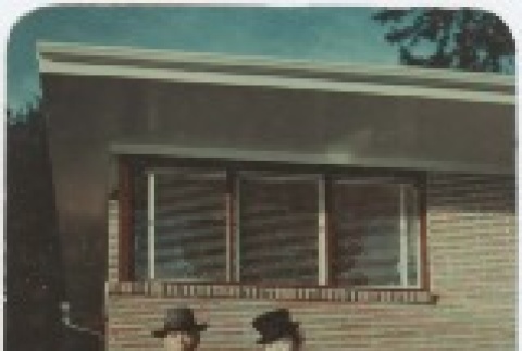 (Photograph) - Image of man and woman standing in front of building (PDF) (ddr-densho-332-4-mezzanine-697b723164)