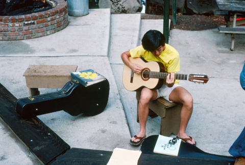 Kyle Kashima playing guitar (ddr-densho-336-994)