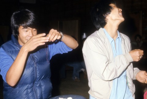 David Yamamura and Ken Sasaki participating in icebreakers (ddr-densho-336-737)