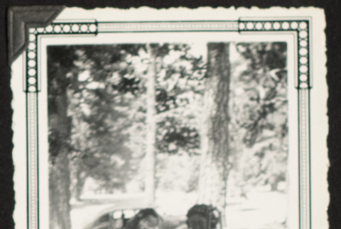 Two young women at a campsite (ddr-densho-542-386)