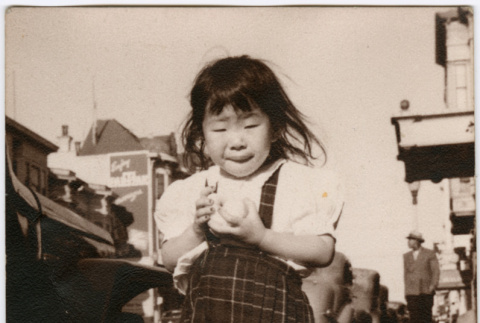 Masako Takahashi standing on sidewalk (ddr-densho-426-970)