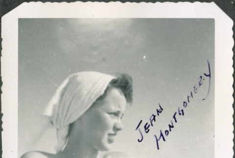Woman sunbathing with a towel on her head (ddr-densho-321-383)