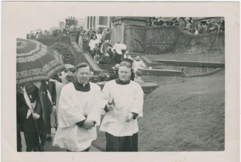 Two priests and crowd outside Maryknoll (ddr-densho-330-286)