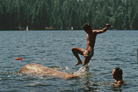 Roger Morimoto log rolling in the lake (ddr-densho-336-1129)