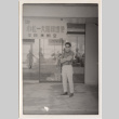 Man standing in front of business (ddr-densho-426-90)