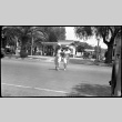 Two women crossing a street (ddr-densho-480-44)