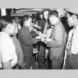 Indonesian deportees changing currency (ddr-csujad-27-5)