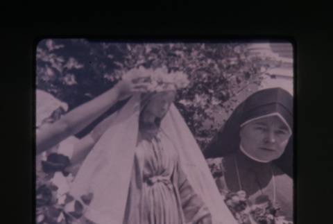(Slide) - Image of nun next to statue of Mary (ddr-densho-330-97-master-4ef7e5363b)