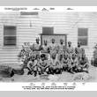 Group photo of men in uniform outside Topaz camp building.  Joe Iwataki standing second from left (ddr-ajah-2-785)