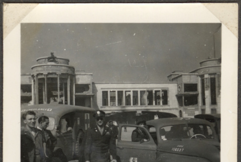 Men in uniform standing cars (ddr-densho-466-17)