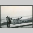 Chester and Agnes Sakura standing by carved canoe (ddr-densho-523-386)