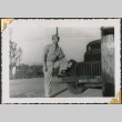 Man standing by Military Police truck (ddr-densho-434-372)