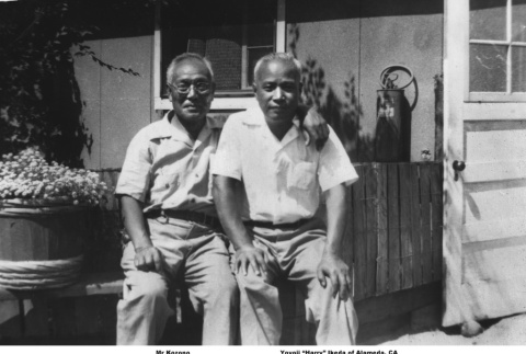 Two men sitting outside barracks (ddr-ajah-6-432)