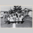 Large group of men, women and children in yard outside house (ddr-densho-522-58)