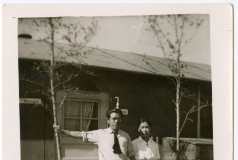 Two men standing outside barracks door (ddr-densho-329-1330)