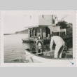 A girl being rowed away from an oyster barge (ddr-densho-296-86)