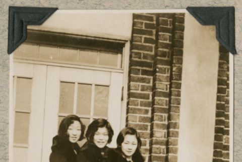 Three women in matching coats (ddr-densho-383-329)