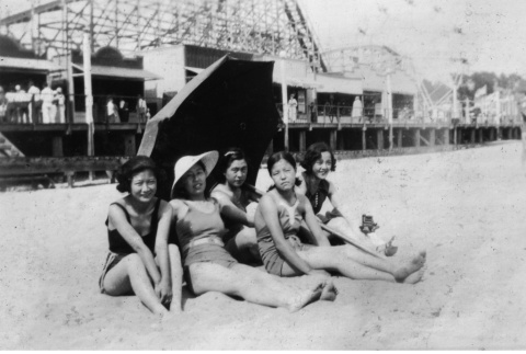 Five young women sitting on beach (ddr-ajah-6-480)