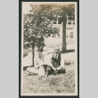 man and woman in a yard (ddr-densho-378-829)