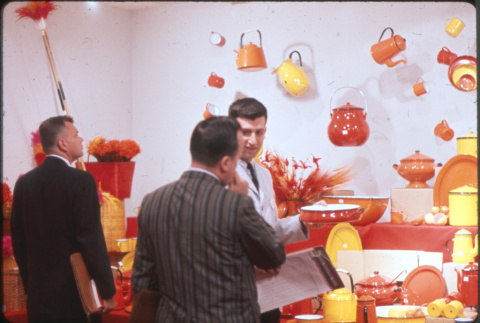 Three men looking at enamel ware display (ddr-densho-426-367)