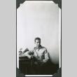 Man sitting at desk (ddr-ajah-2-687)
