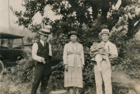 Group photo of two men, one woman, and a little girl (ddr-densho-348-70)