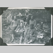 Six men resting with gear.  Joe Iwataki on far left (ddr-ajah-2-250)
