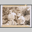 Two children riding a bicycle and a tricycle (ddr-densho-483-1080)