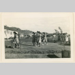 Dietitian aids walking to a hospital tea party (ddr-densho-37-1258)