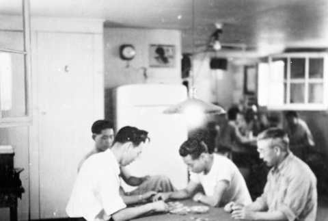 Japanese Americans playing cards at the fire station (ddr-densho-15-59)