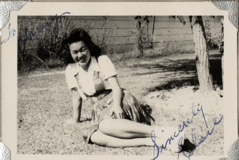 Woman sitting on lawn (ddr-densho-587-60)