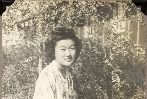 Woman kneeling on lawn (ddr-densho-587-93)