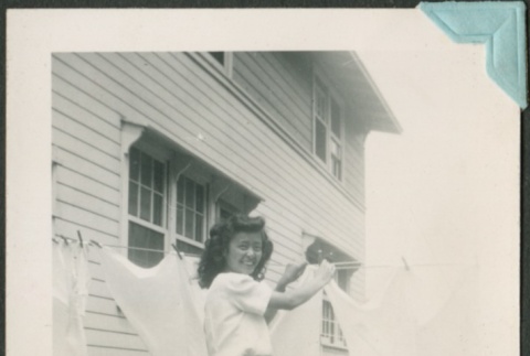 A woman hanging laundry to dry (ddr-densho-328-87)