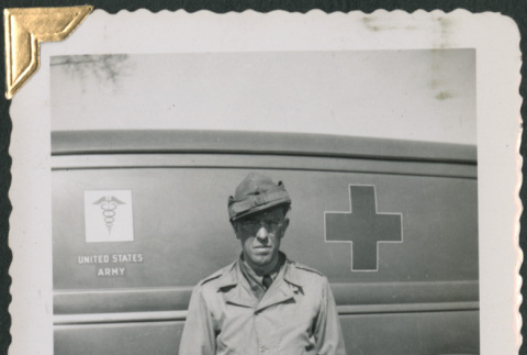 Man standing next to Army medical truck (ddr-densho-434-38)
