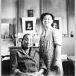 Two Japanese Americans in their barracks apartment (ddr-densho-15-58)
