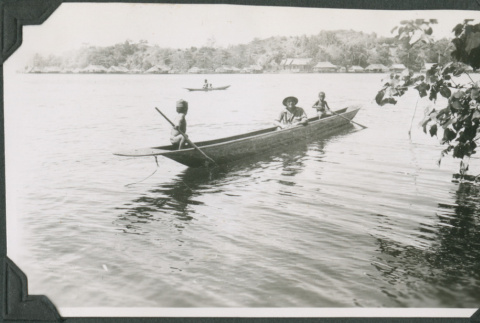 Man and two children in canoe (ddr-ajah-2-628)