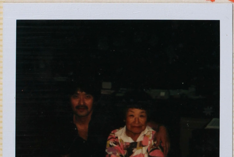 Man and woman sitting at a table (ddr-densho-426-1339)