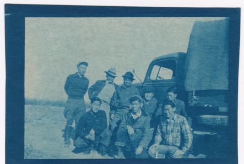 Group of men next to truck (ddr-densho-329-1381)