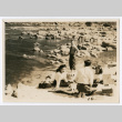 Mitsuye Takemiya and Charles Roeslin Jr. with others at beach (ddr-densho-550-38)