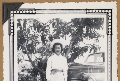 Mits poses beside a car (ddr-densho-542-55)